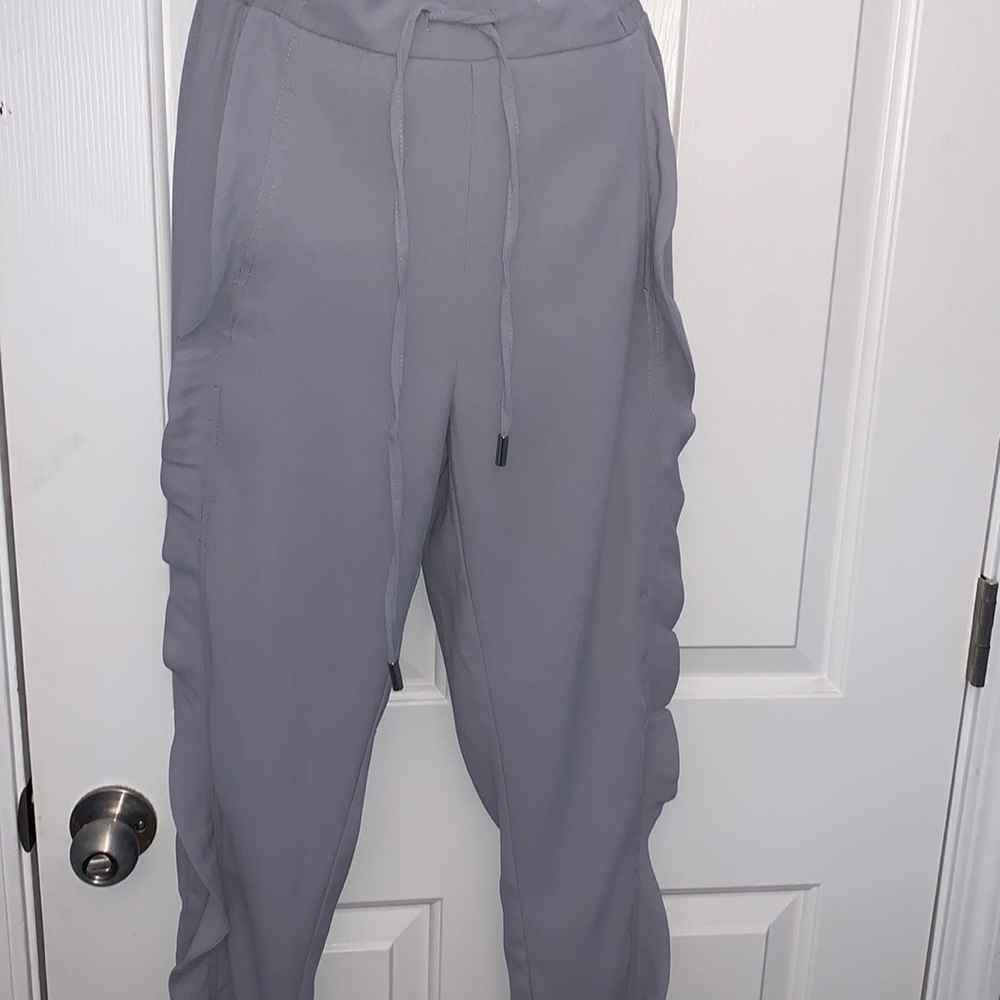 Light gray womens dress polyester pant with side ruffles